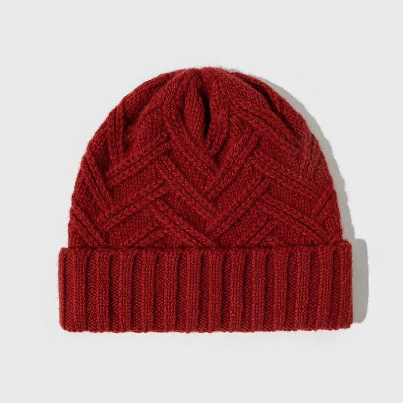 Women's wool knitted dome winter hat with a textured totem pattern.