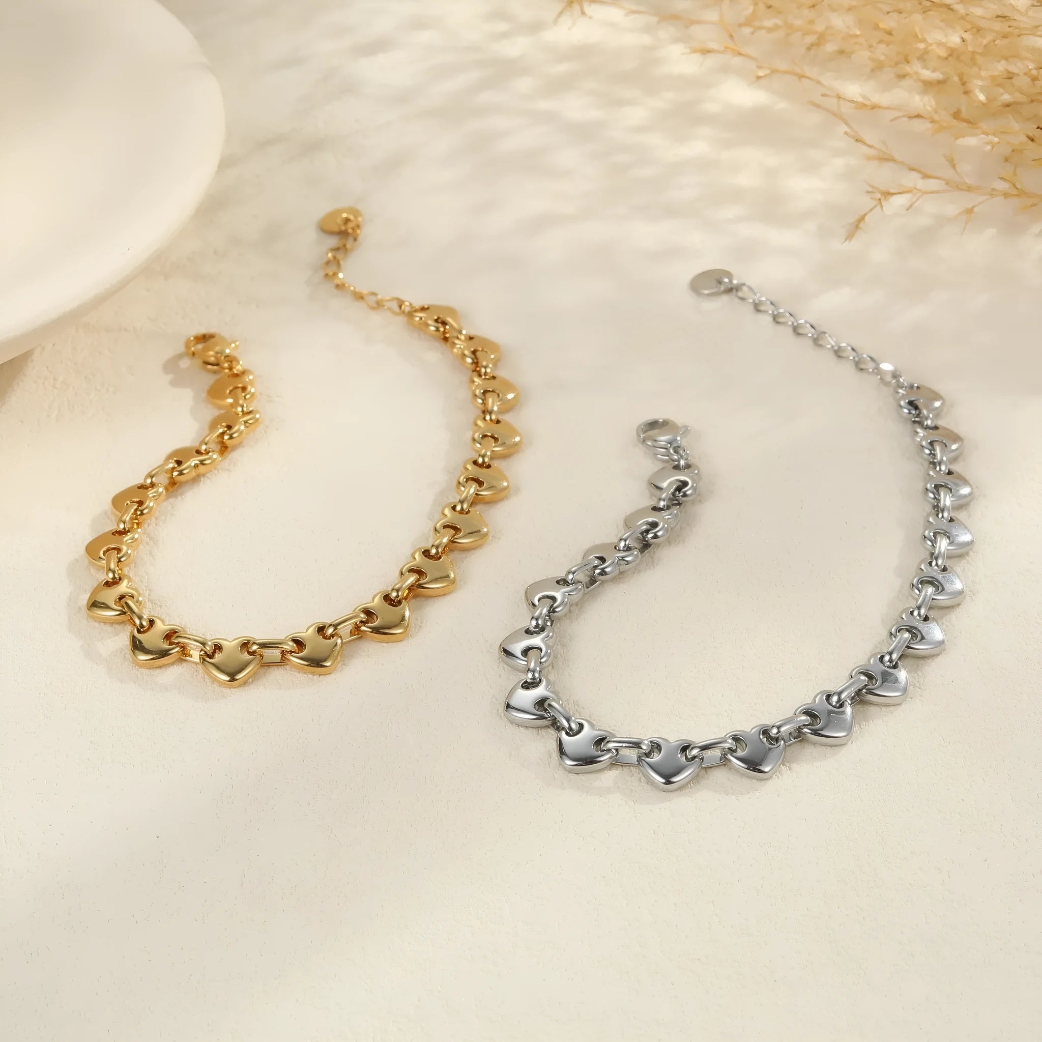 Women's hollowed-out heart bracelet in gold finish with geometric design and stainless steel construction