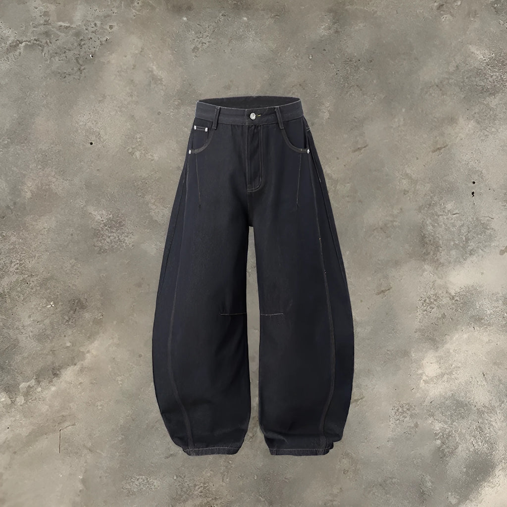 Men's original cow colour wide leg denim trousers with a mid-waist, laid flat.