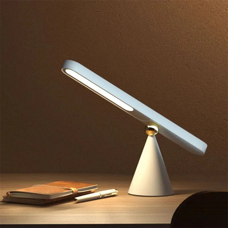 Geometric table lamp with magnetic suction base showing white and khaki colour options