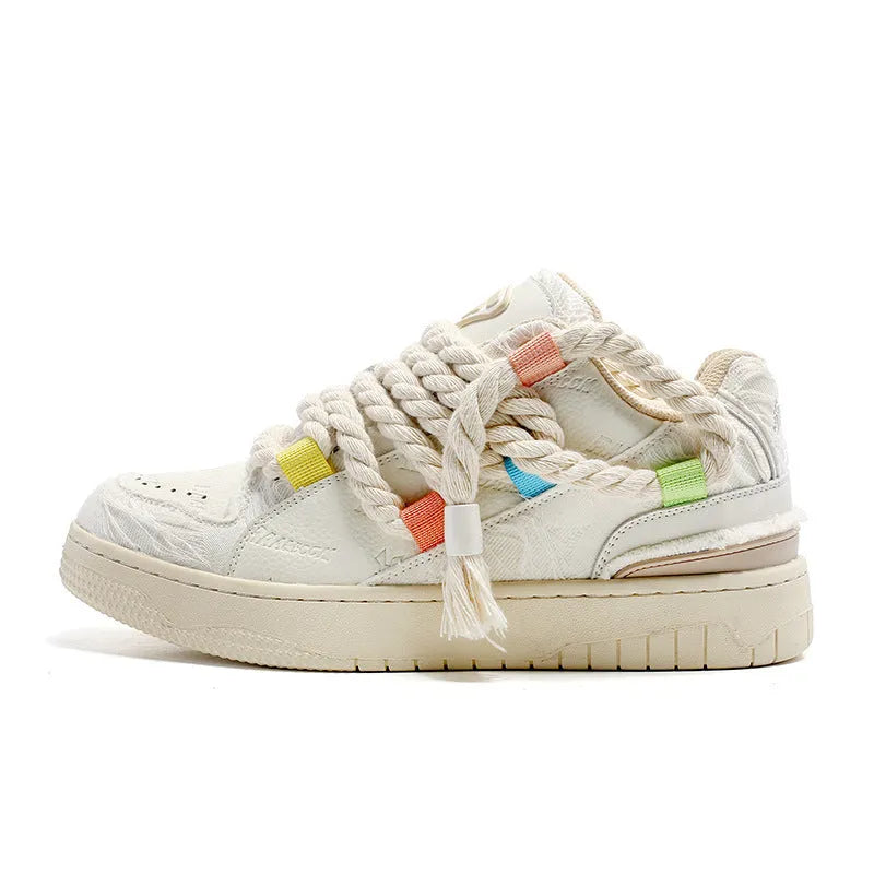 Creamy white Old Damage retro lace-up skateboard shoes with platform sole on a plain background.