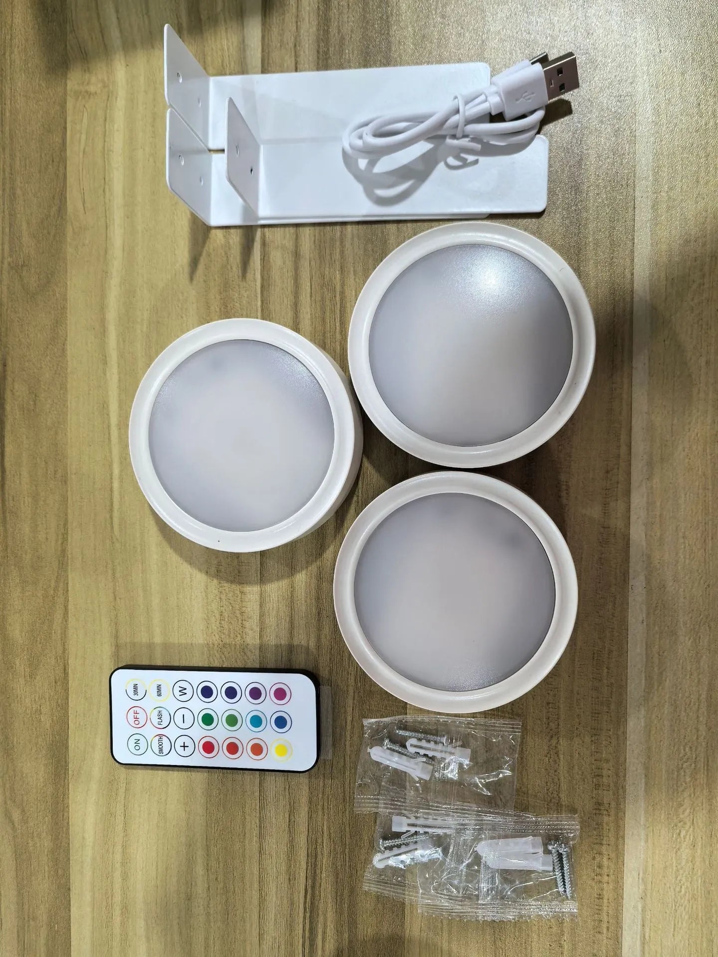 Wireless LED painting lamp with magnetic charging and remote control in black, white or gold finish