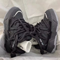 Women's grey retro chunky platform sneakers with thick rubber sole and lace-up front.