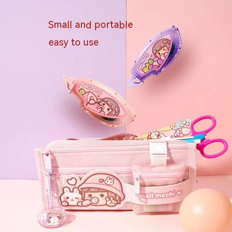 Dotting glue applicator in peach juice colour on a card, a high viscosity traceless adhesive for crafts.
