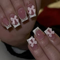 Short white French fake nails with cute bow and tulip patterns for ladies manicure