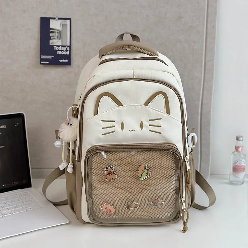 Korean cartoon large capacity nylon backpack in pink colour with badge pendant.