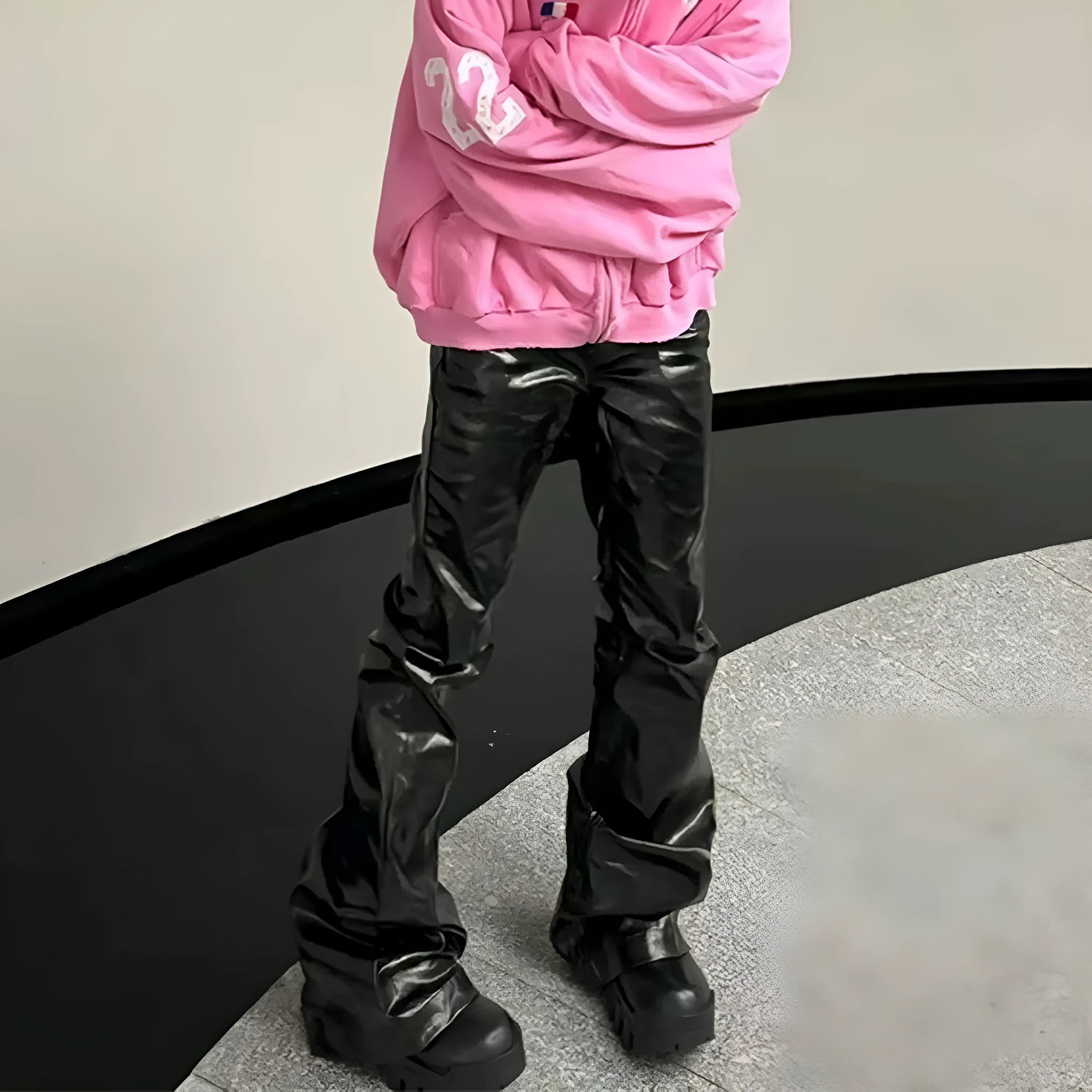 Black women's skinny jeans with a shiny patent leather coating and straight-leg style.