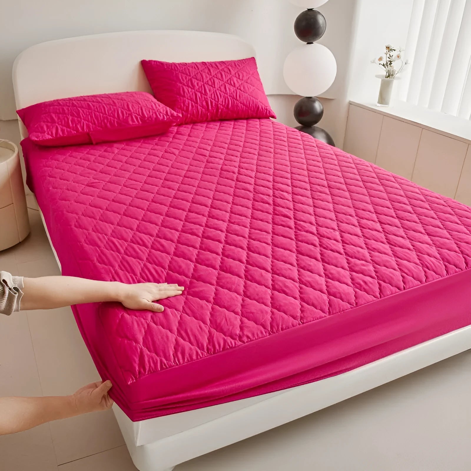 Diamond lattice quilted waterproof mattress protector set with bamboo fibre fitted sheet and pillowcases.