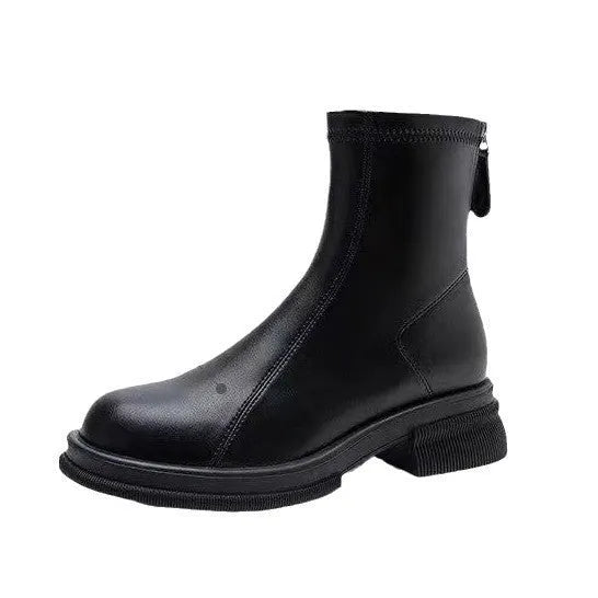 Women's black ankle boot with flat heel, round toe, and back zipper on a white background