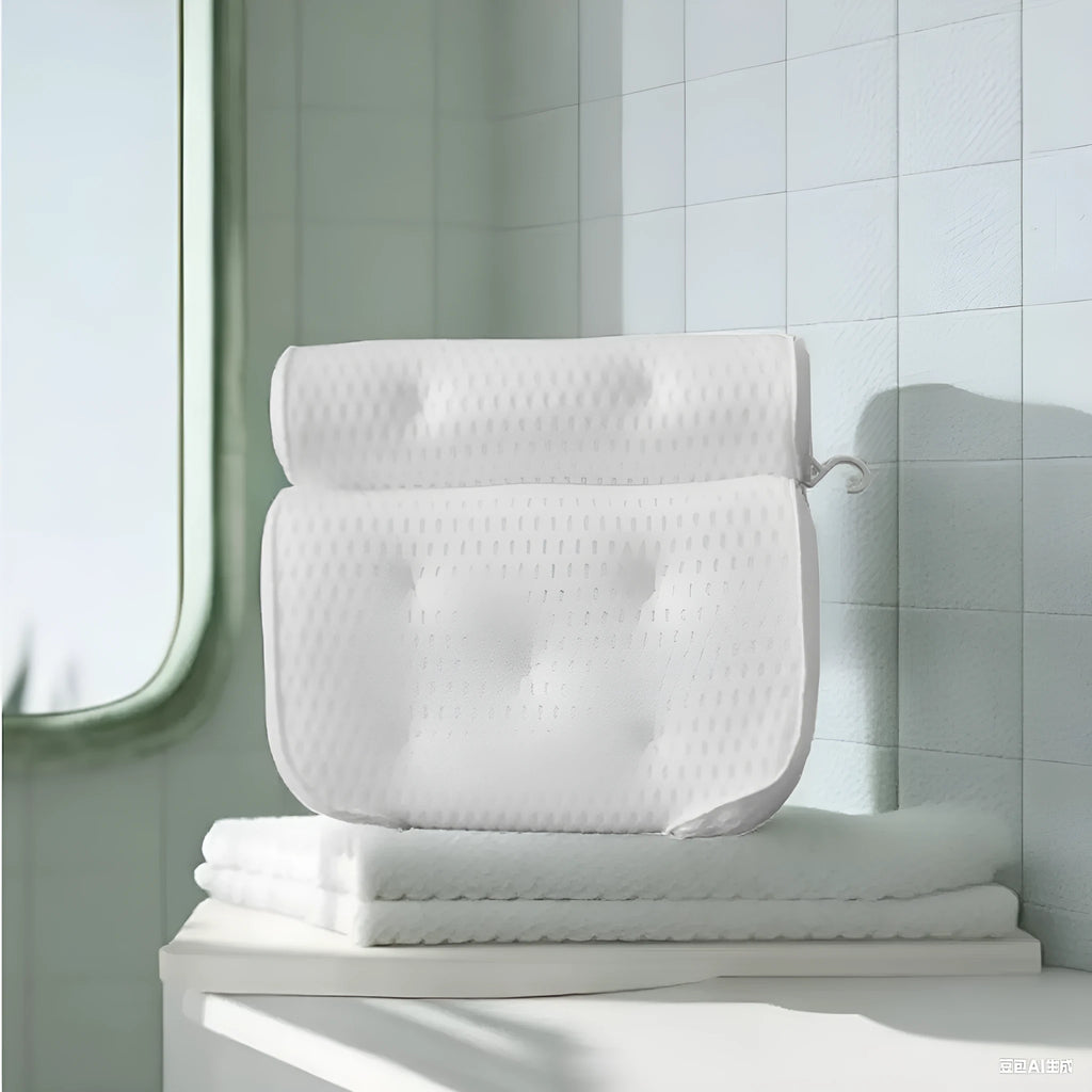 White 4D mesh bathtub pillow with suction cups, shown on bathtub edge.