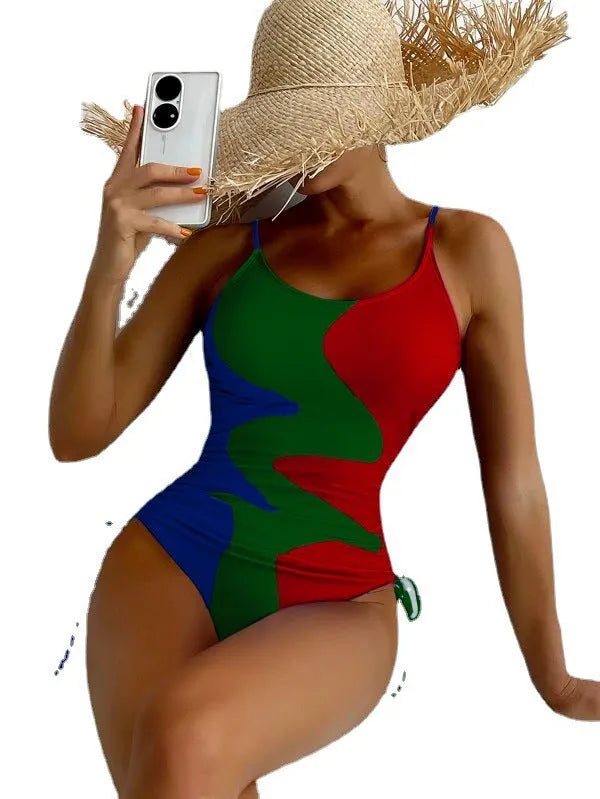 Women's sleeveless backless one-piece swimsuit in blue, shown on a mannequin.