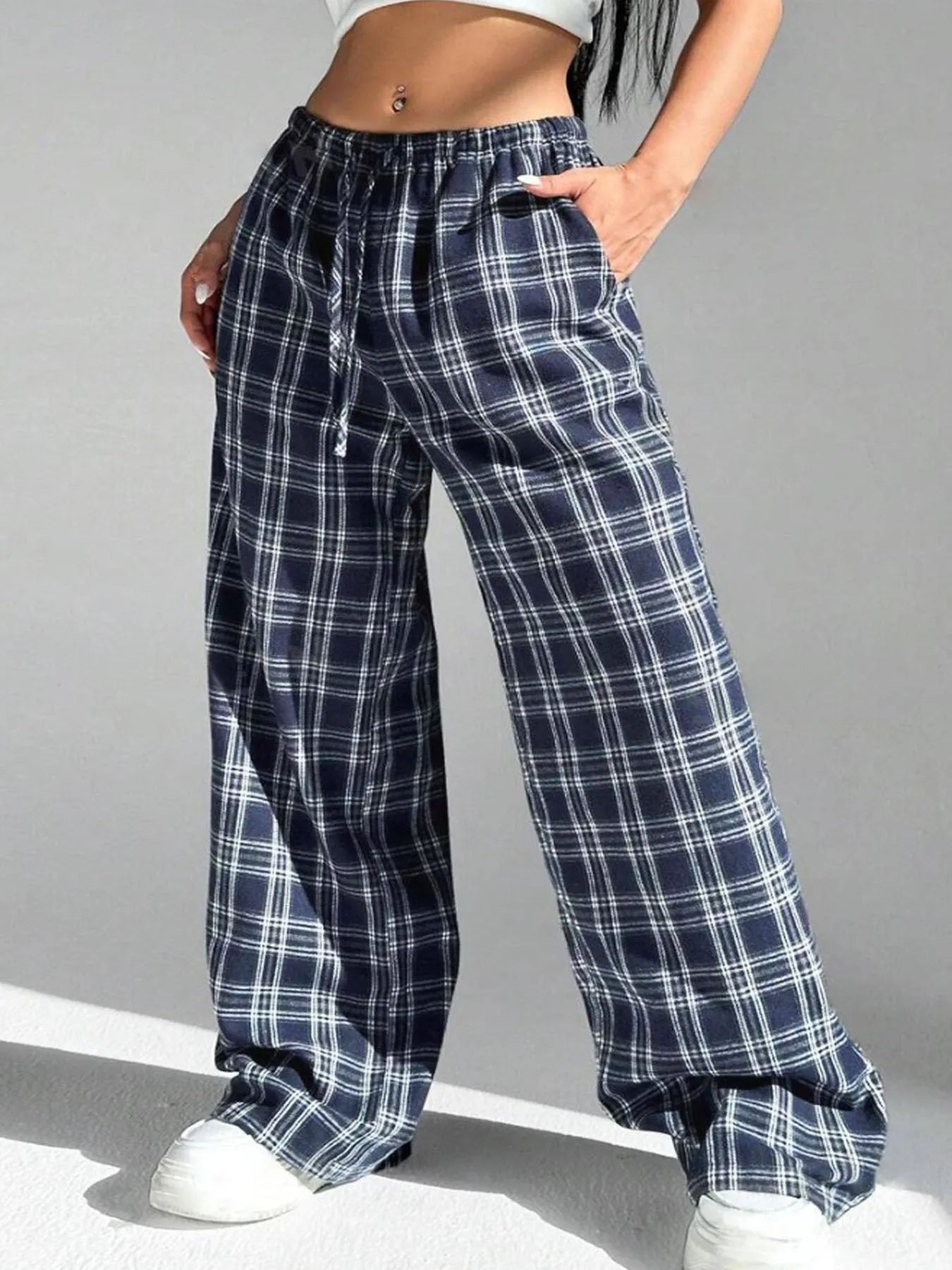 Women's loose fit plaid trousers with drawstring waist and side pockets in red and blue colours