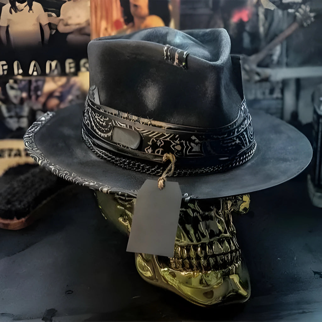 Handmade wool felt skull hat with a conical crown on a neutral background