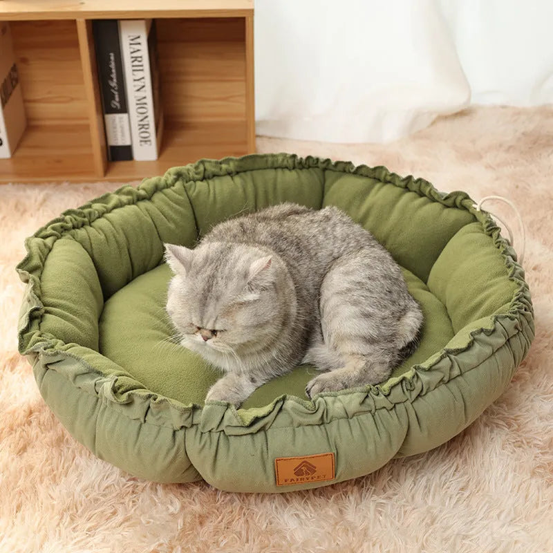 Reversible grey and green donut cat bed with raised rim in three sizes