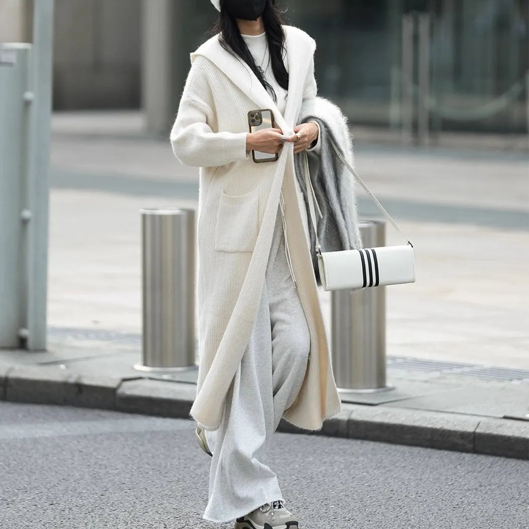 Long knitted hooded cardigan trench coat in wool blend cashmere fabric showing splicing sleeve details