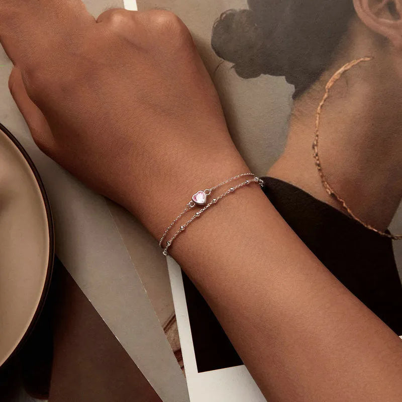 Sweet girlish style 925 sterling silver bracelet with a small heart-shaped charm on an adjustable chain.