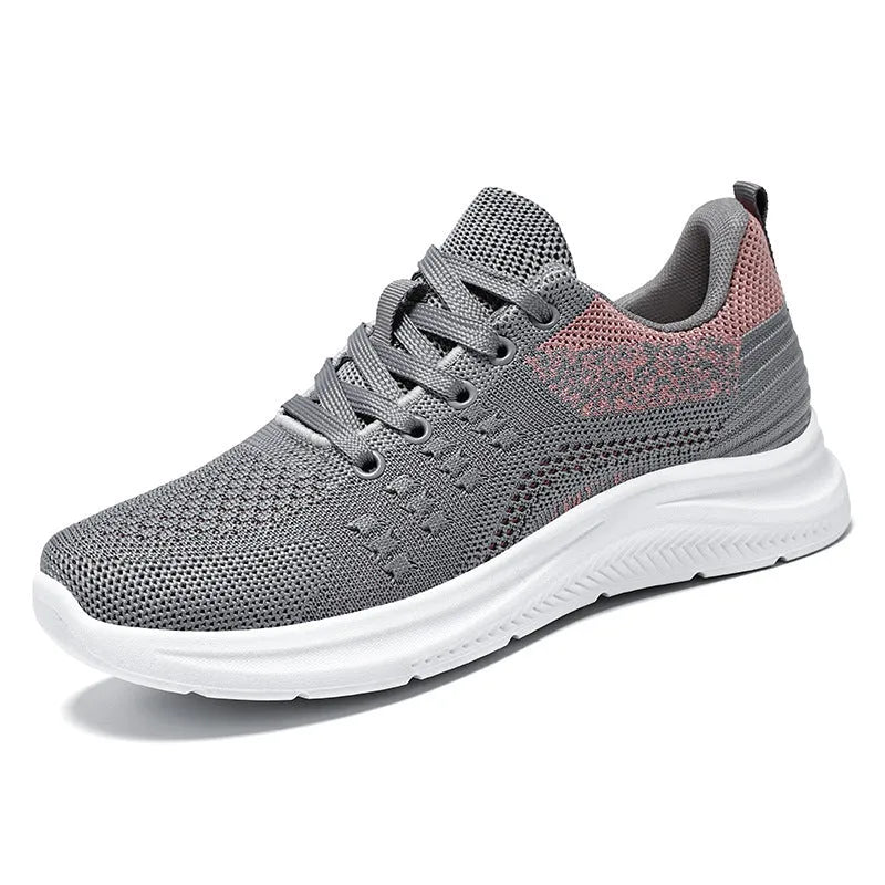 Women's black mesh sneakers with round toe and lace-up design on white background