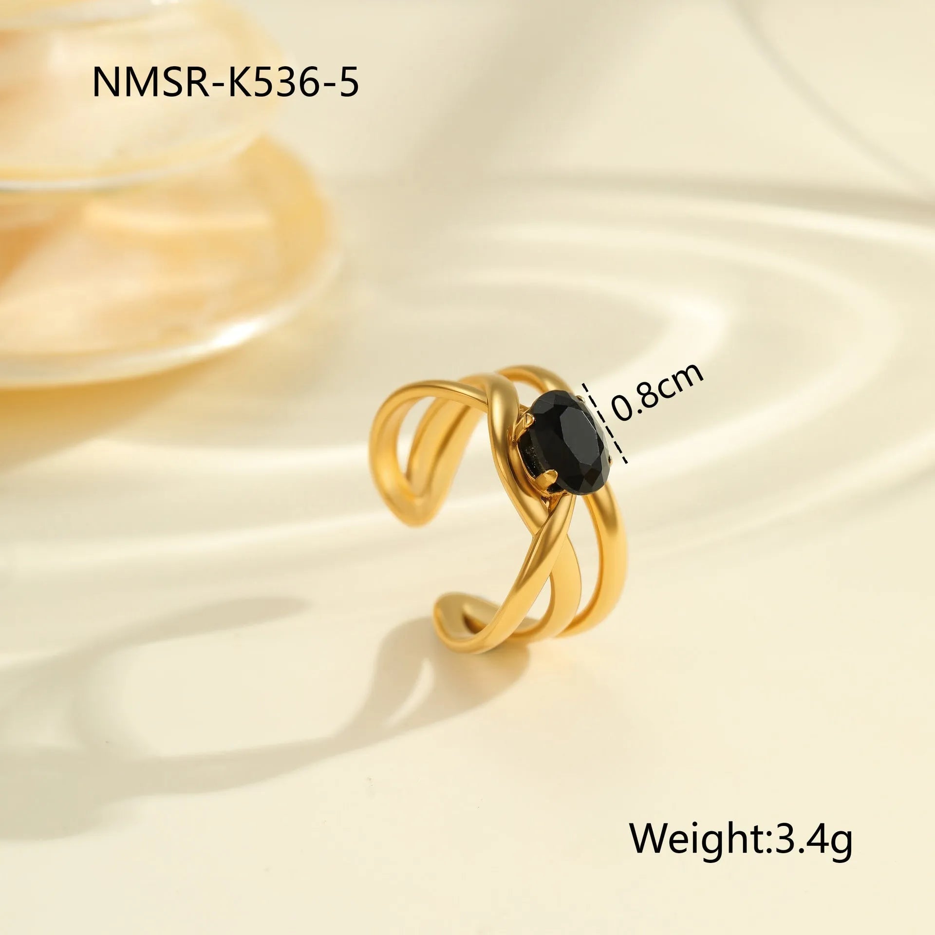 Geometric open mouth titanium steel ring for women on a plain background.