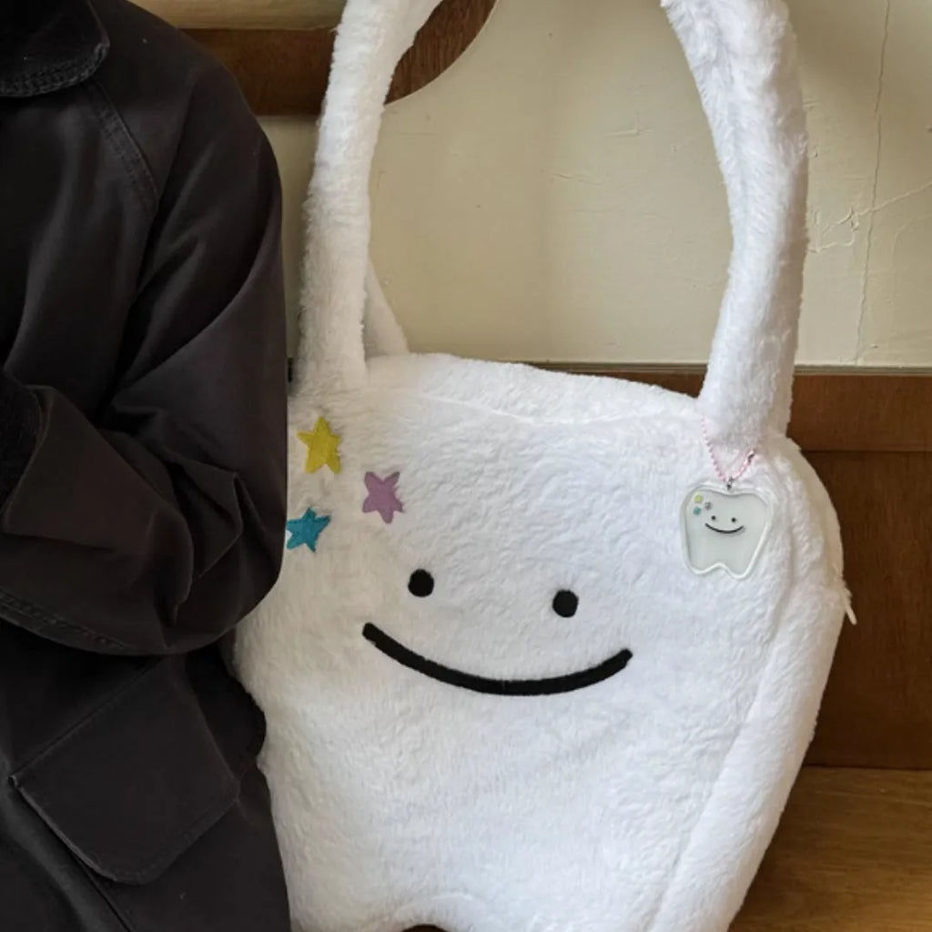 White plush shoulder tote bag with cute teeth pattern and front zip closure