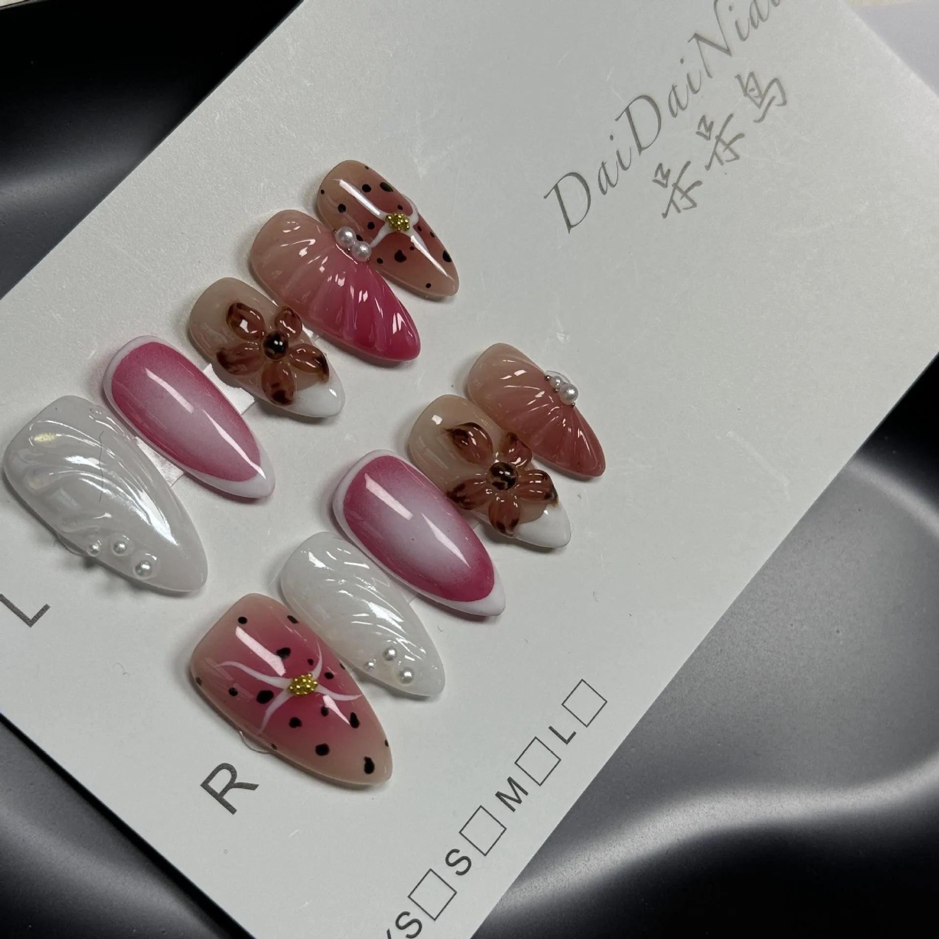 Set of hand-painted 3D carved nail beauty patches in embossed cute patterns.