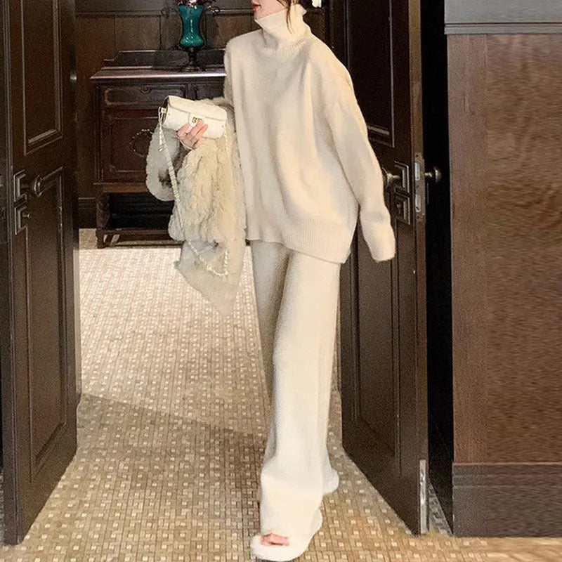Women's solid colour sweater and wide leg trousers two-piece set in beige, shown as a coordinated outfit.