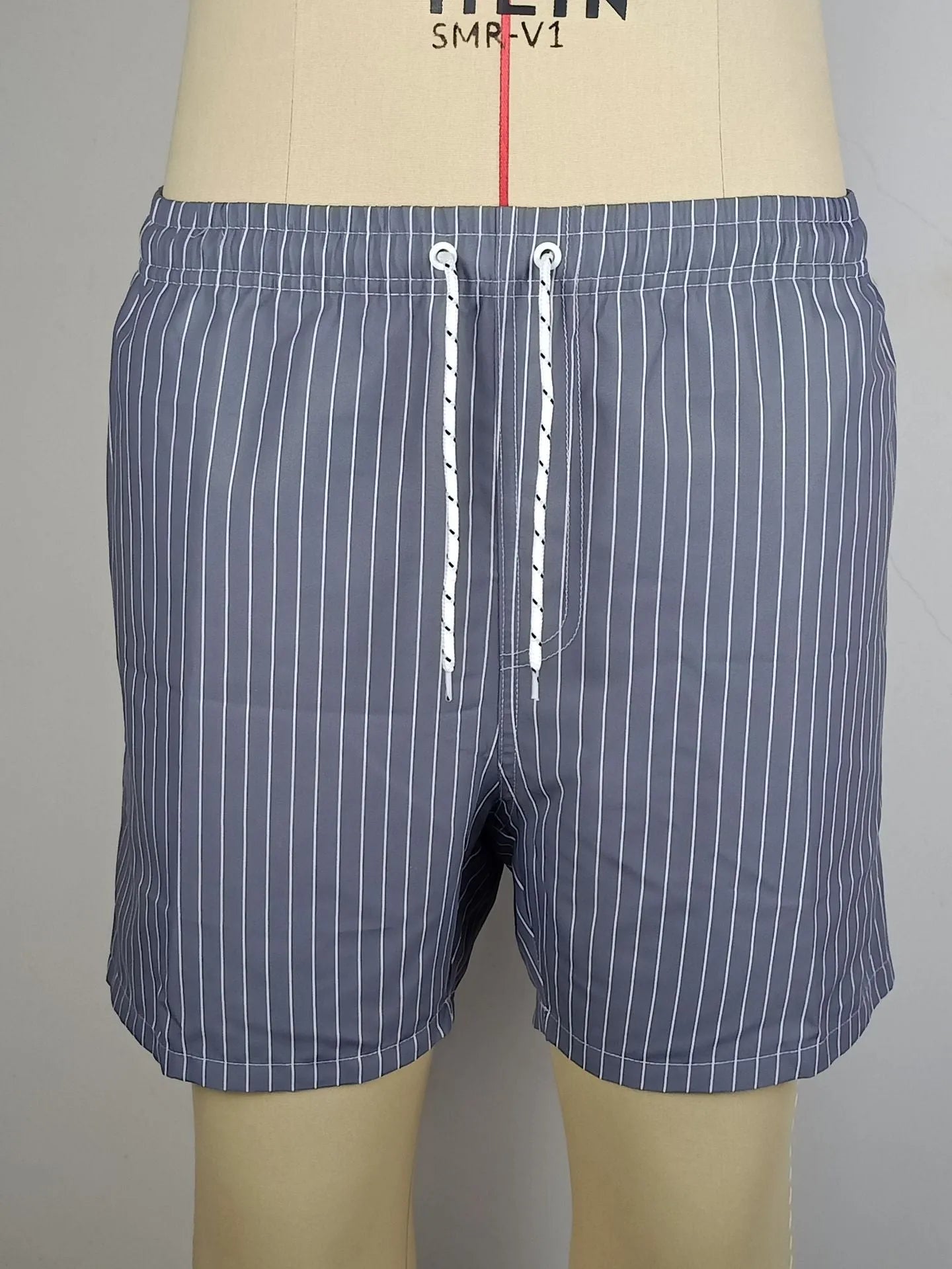 Striped casual shorts in light blue, shown front-on, with straight leg opening.