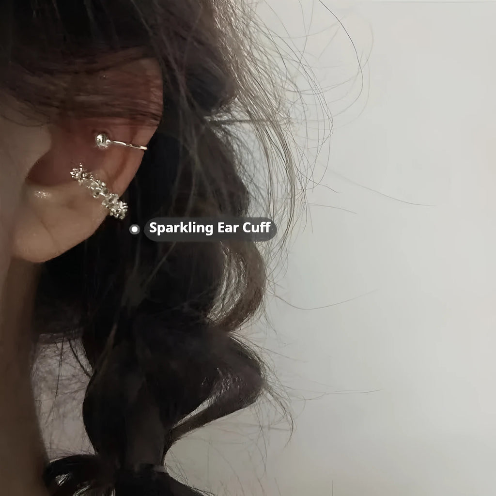 A pair of frosty-finish geometric alloy earrings with ear clip fastenings.
