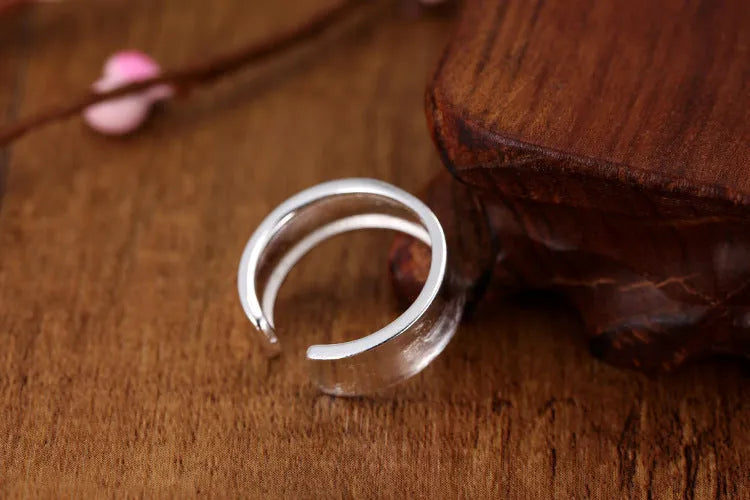 Sterling silver geometric open ring with frosted finish and adjustable opening