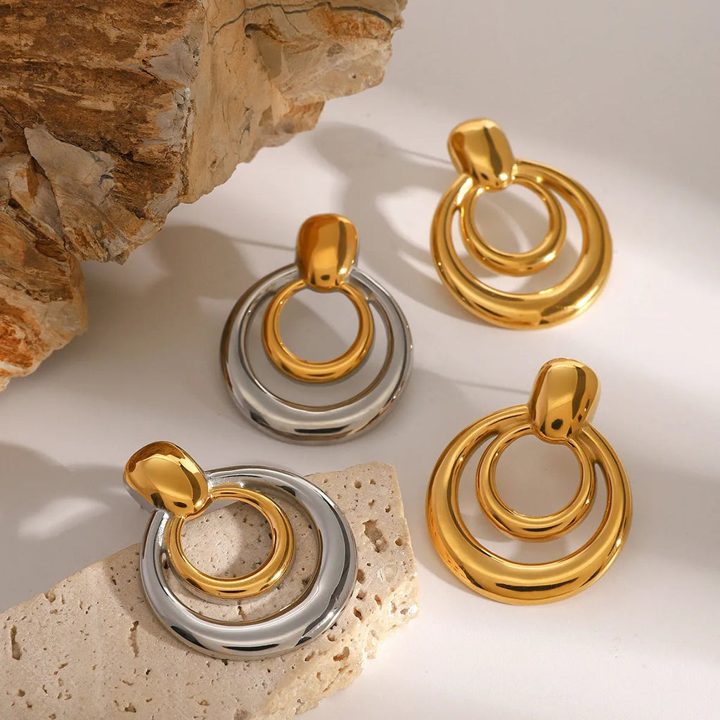 Gold plated titanium steel double layer hollow stud earrings with round geometric design