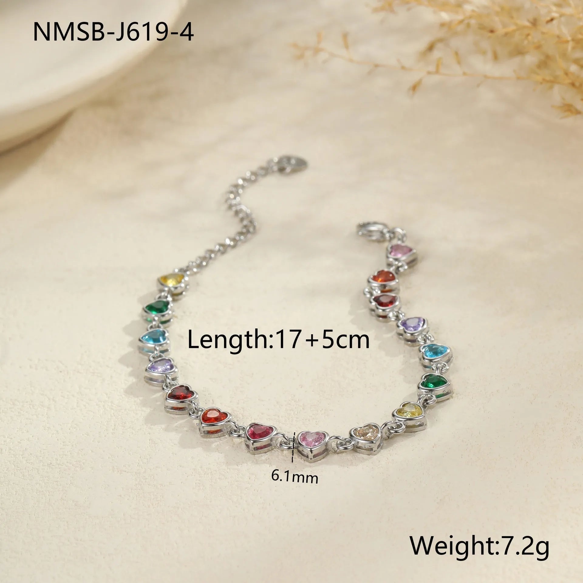 Gold and silver electroplated stainless steel bracelet with square, heart, and round geometric designs