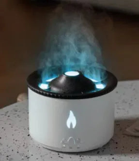 White volcano-shaped humidifier emitting a two-colour mist spray ring.