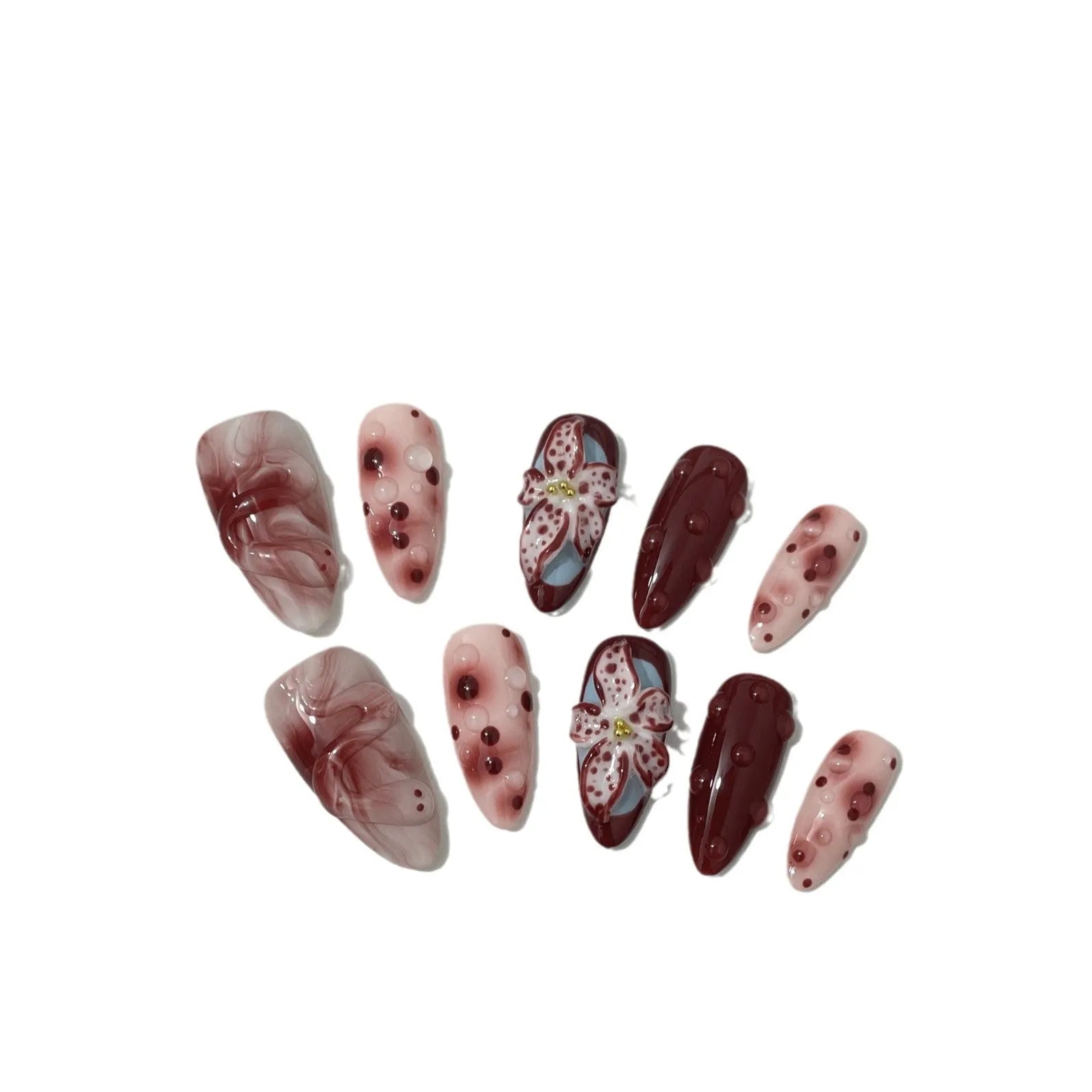 Hand-painted 3D carved artificial nails with floral designs on almond-shaped tips