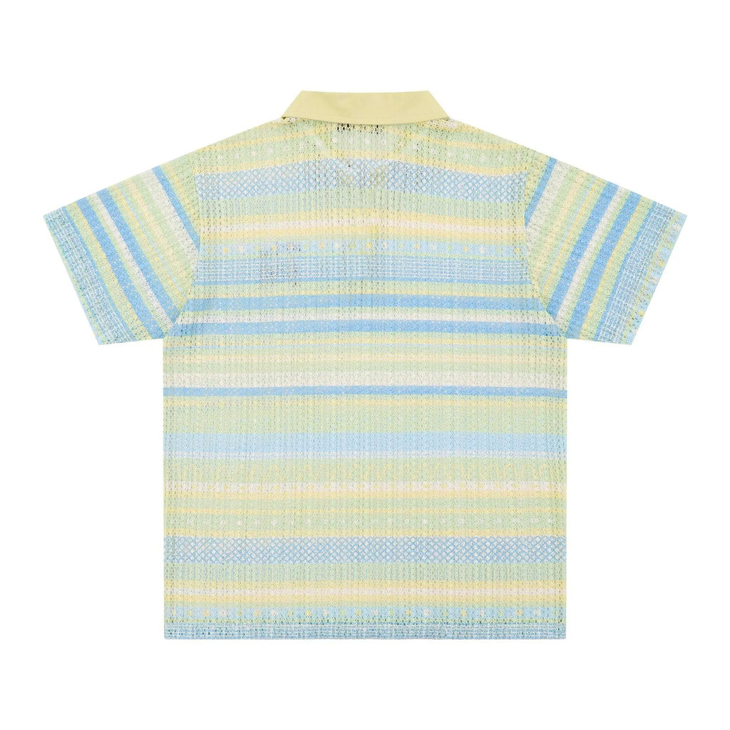 Man wearing a blue loose-fit printed casual short sleeve shirt made from elastic polyester fabric.