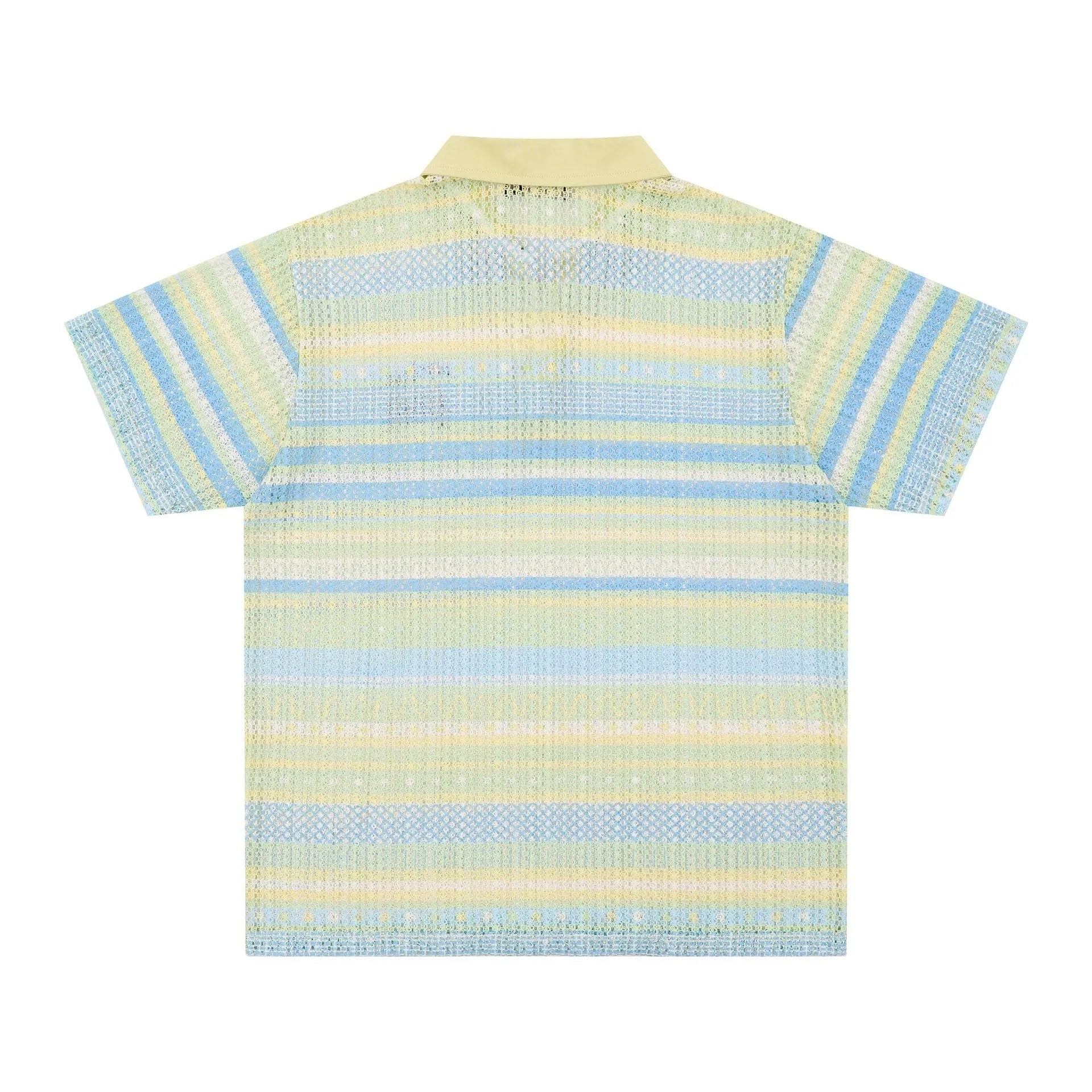 Man wearing a blue loose-fit printed casual short sleeve shirt made from elastic polyester fabric.
