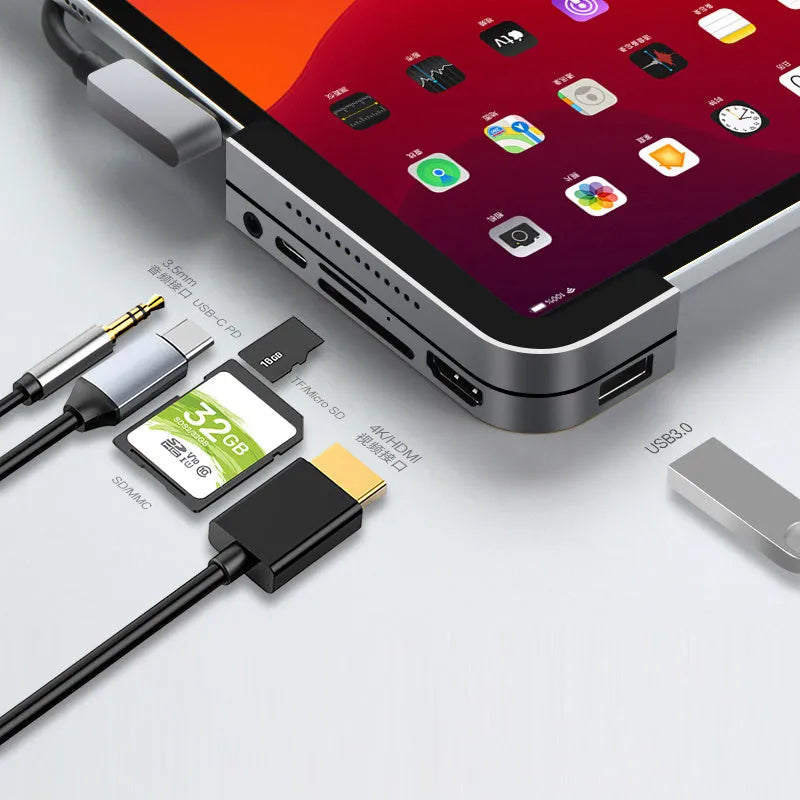 Silver aluminium grey USB-C 6-in-1 docking station for iPad Pro models with multiple ports.