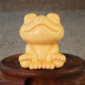 Small smiling frog ornament carved from solid bamboo measuring 5cm in height