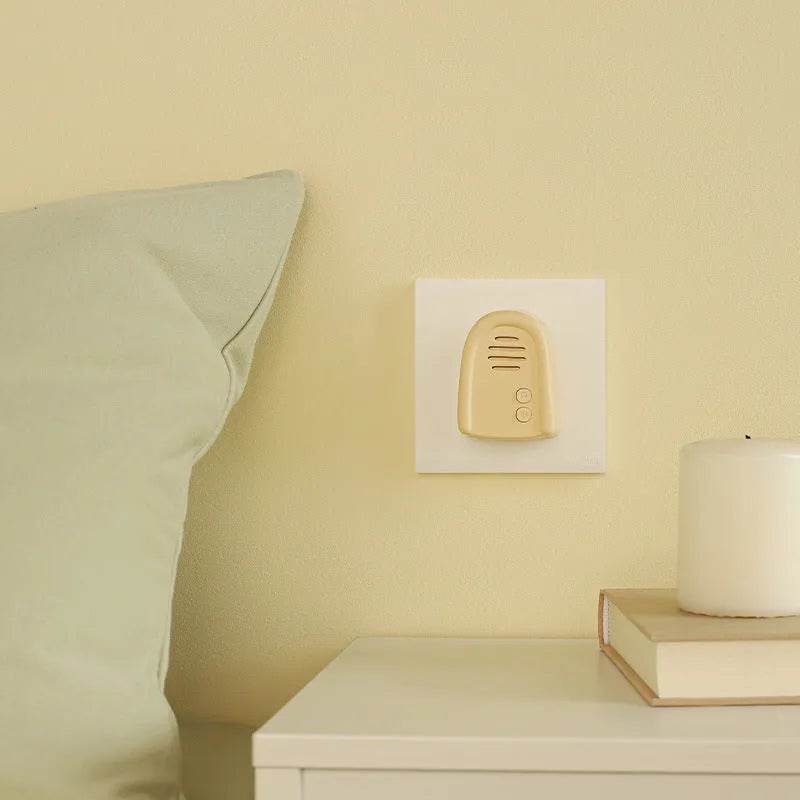 Plug-in wireless doorbell with self-generating beeper in milky yellow or white colour for household use