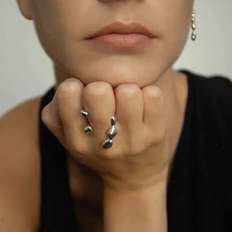 Adjustable brass opening ring with spherical design in gold or silver colour