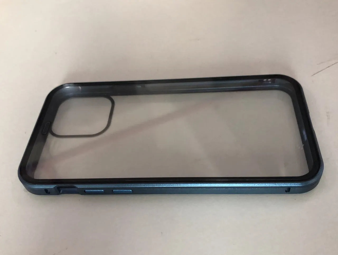 Black glass clamshell anti-spy case on an iPhone, showing geometric design and solid colour.