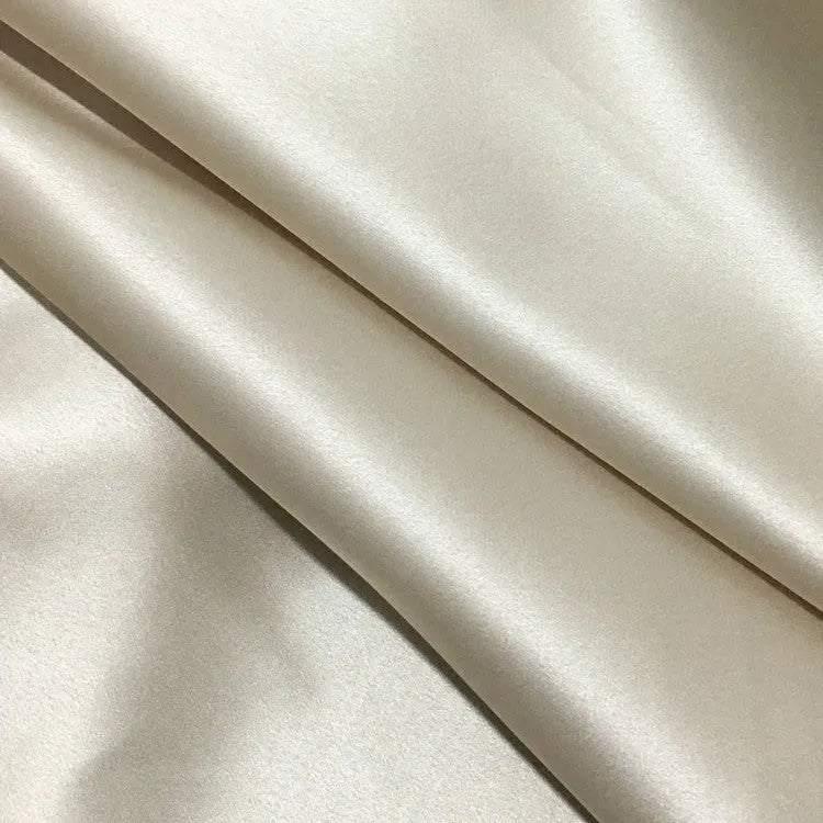 Dark grey silk pillowcase with envelope closure, shown flat and on a pillow.