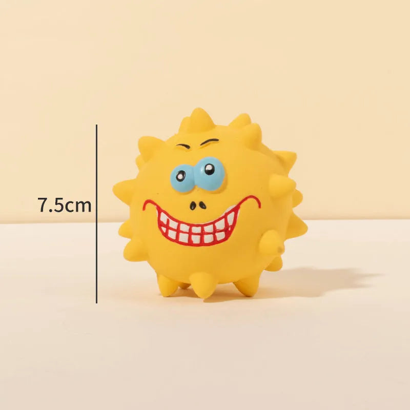 Four colourful squeaky dog balls with cute faces made from natural latex rubber with textured surfaces