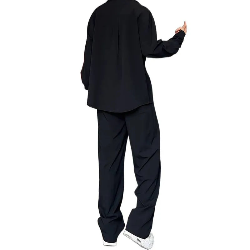 Men's black slim fit polo shirt and trousers two-piece casual suit on a hanger.