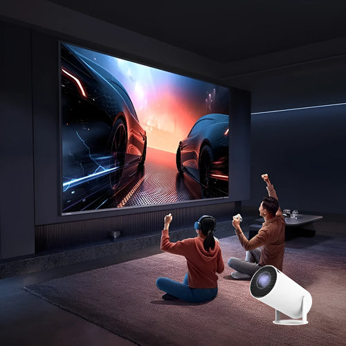 White Barrel X10 PLUS portable smart HD projector with gamepad and remote control on a table.