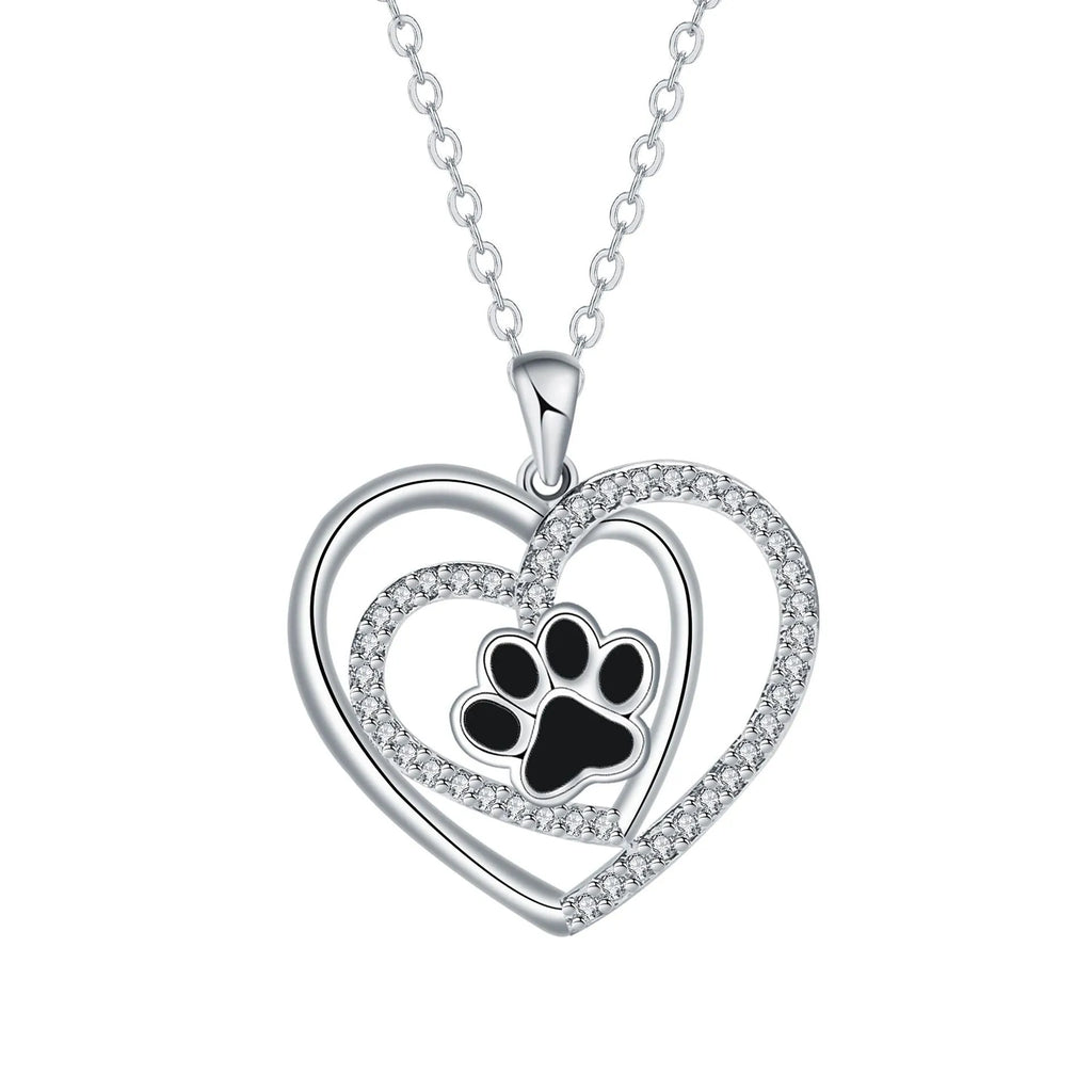 Women's copper necklace with dog's paw footprints and heart-shaped pendant on cross chain