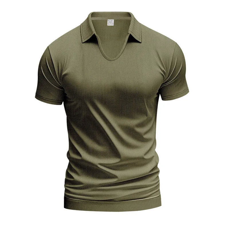 Man wearing a loose-fit apricot coloured V-neck short sleeve cotton blend T-shirt.