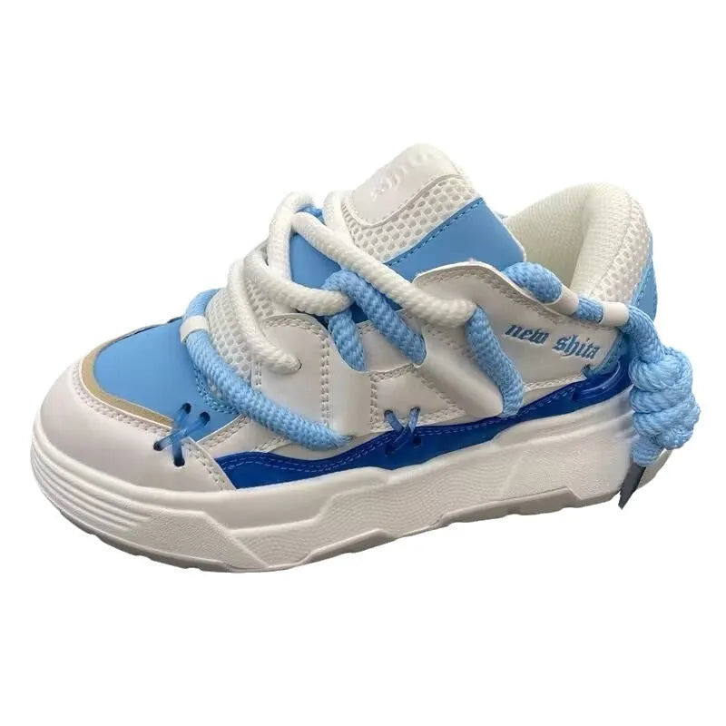 Women's grey retro chunky platform sneakers with thick rubber sole and lace-up front.