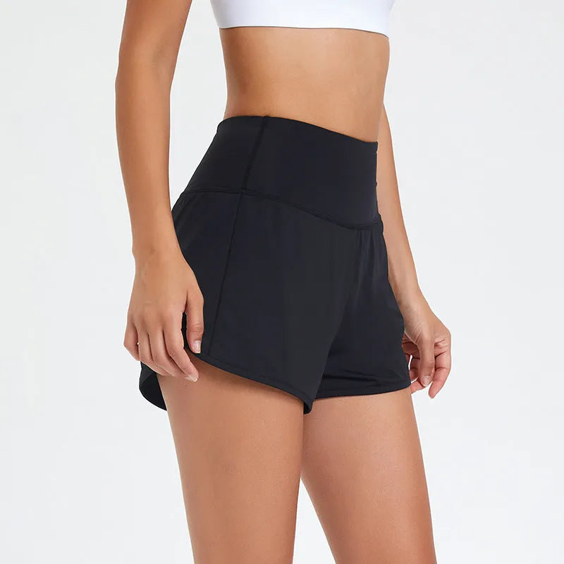 Women's black high-waist quick-dry nylon sports shorts for running and fitness.