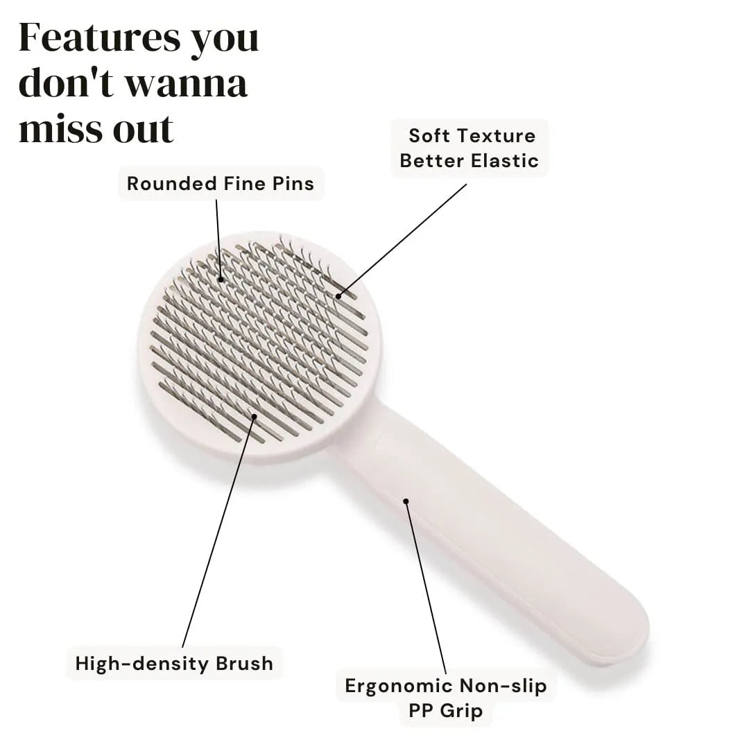 Blue self-cleaning pet grooming brush with ergonomic rubber handle on a white background