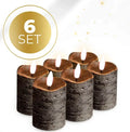 Black LED flameless pillar candle with remote control on a table, showing its 5cm diameter and 7cm height.
