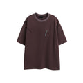 Purple and black loose-fit short-sleeved cotton t-shirt with embroidered retro design on a washed fabric.